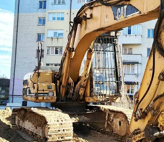 Желтый Катерпиллер 318, объемом двигателя 0 л и пробегом 13 тыс. км за 12000 $, фото 1 на Automoto.ua