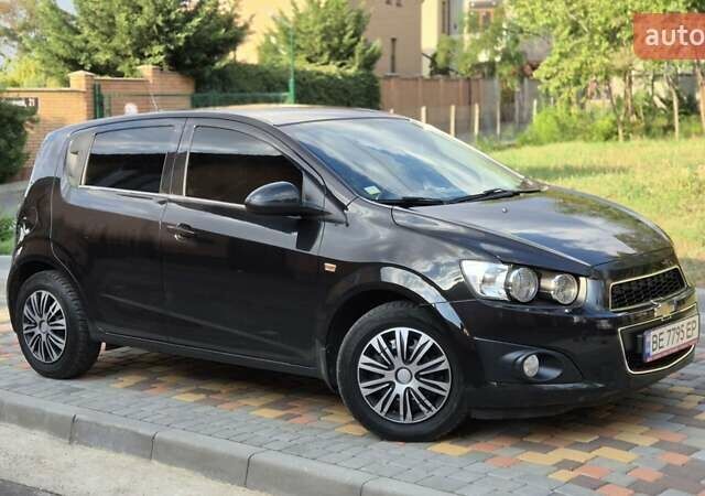 Черный Шевроле Авео, объемом двигателя 1.6 л и пробегом 168 тыс. км за 6650 $, фото 1 на Automoto.ua