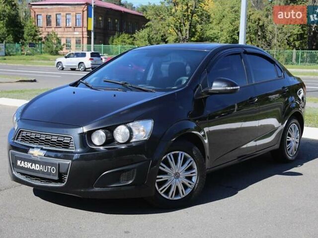 Черный Шевроле Авео, объемом двигателя 1.4 л и пробегом 155 тыс. км за 7000 $, фото 1 на Automoto.ua