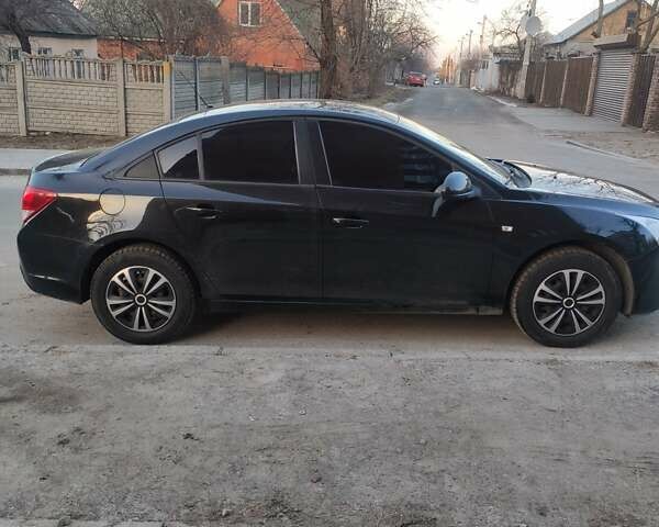 Черный Шевроле Круз, объемом двигателя 1.6 л и пробегом 200 тыс. км за 7500 $, фото 1 на Automoto.ua