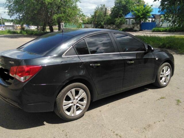 Черный Шевроле Круз, объемом двигателя 1.8 л и пробегом 143 тыс. км за 7000 $, фото 1 на Automoto.ua