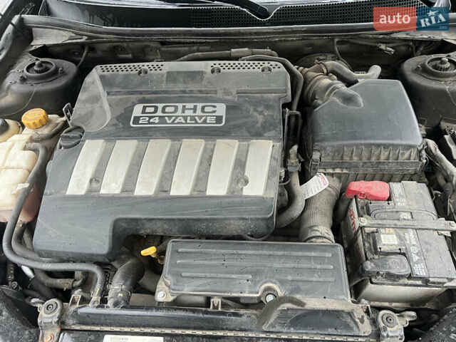 Черный Шевроле Эпика, объемом двигателя 1.99 л и пробегом 137 тыс. км за 6500 $, фото 1 на Automoto.ua