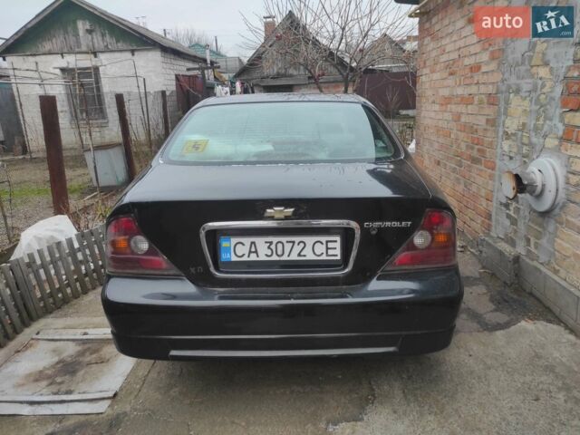 Чорний Шевроле Еванда, об'ємом двигуна 2 л та пробігом 372 тис. км за 3000 $, фото 1 на Automoto.ua