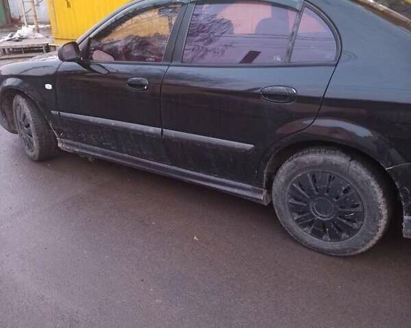 Черный Шевроле Эванда, объемом двигателя 2 л и пробегом 288 тыс. км за 2300 $, фото 1 на Automoto.ua