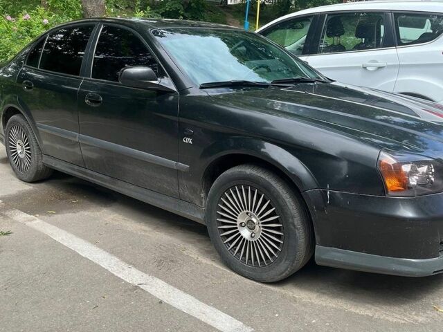 Черный Шевроле Эванда, объемом двигателя 2 л и пробегом 170 тыс. км за 3900 $, фото 1 на Automoto.ua