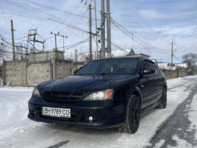 Чорний Шевроле Еванда, об'ємом двигуна 2 л та пробігом 450 тис. км за 3300 $, фото 1 на Automoto.ua