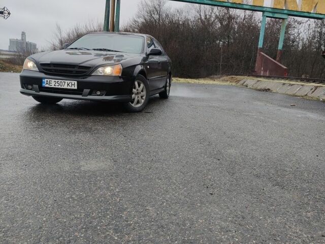 Черный Шевроле Эванда, объемом двигателя 2 л и пробегом 280 тыс. км за 3500 $, фото 1 на Automoto.ua