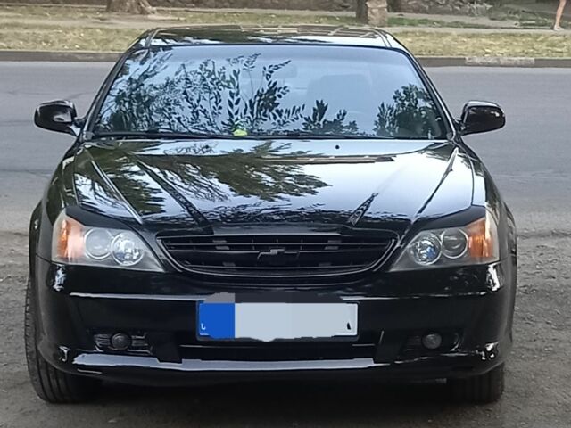 Черный Шевроле Эванда, объемом двигателя 2 л и пробегом 198 тыс. км за 4500 $, фото 1 на Automoto.ua