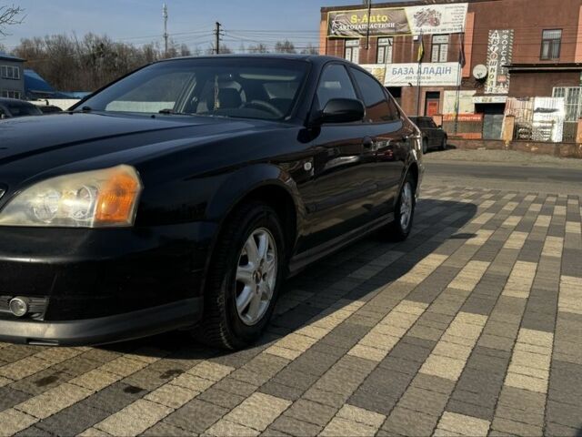 Черный Шевроле Эванда, объемом двигателя 2 л и пробегом 252 тыс. км за 2800 $, фото 1 на Automoto.ua