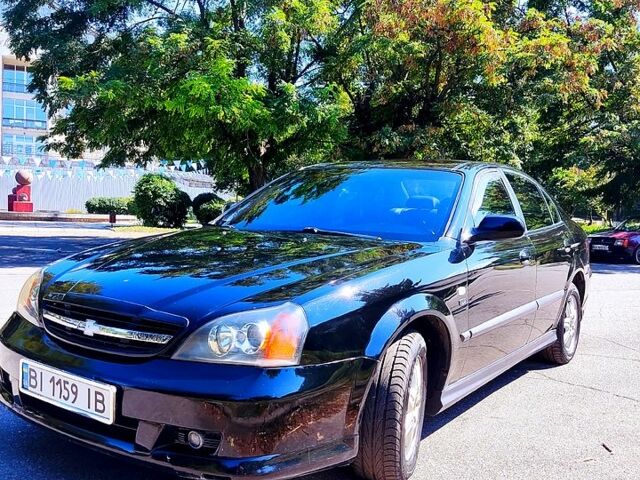 Чорний Шевроле Еванда, об'ємом двигуна 2 л та пробігом 272 тис. км за 4600 $, фото 1 на Automoto.ua