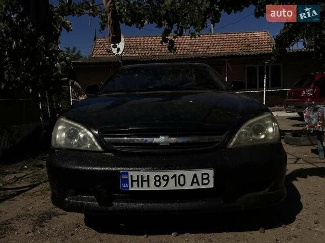 Черный Шевроле Эванда, объемом двигателя 2 л и пробегом 150 тыс. км за 3800 $, фото 1 на Automoto.ua
