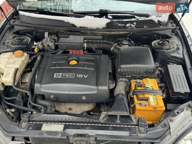 Черный Шевроле Эванда, объемом двигателя 2 л и пробегом 200 тыс. км за 3500 $, фото 1 на Automoto.ua