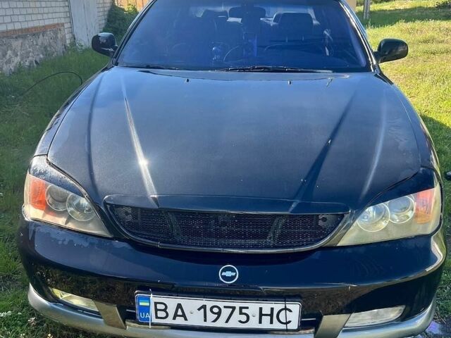 Чорний Шевроле Еванда, об'ємом двигуна 2 л та пробігом 221 тис. км за 3000 $, фото 1 на Automoto.ua