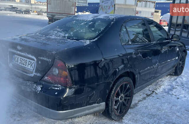 Черный Шевроле Эванда, объемом двигателя 2.5 л и пробегом 315 тыс. км за 3000 $, фото 1 на Automoto.ua