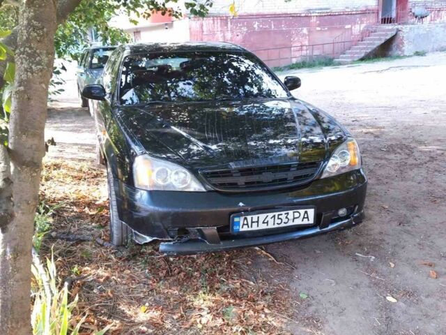 Черный Шевроле Эванда, объемом двигателя 2.5 л и пробегом 270 тыс. км за 2910 $, фото 1 на Automoto.ua