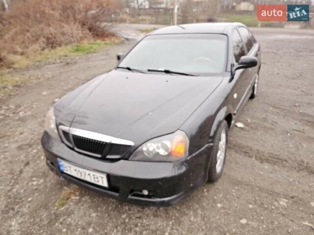 Черный Шевроле Эванда, объемом двигателя 2.5 л и пробегом 256 тыс. км за 4199 $, фото 1 на Automoto.ua