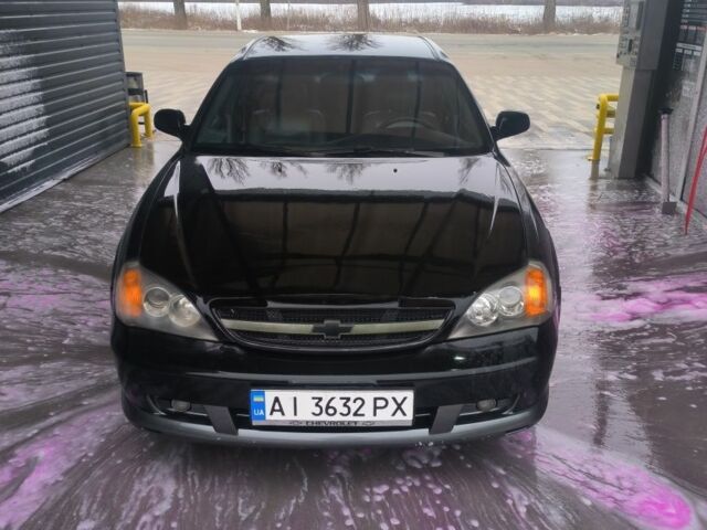 Черный Шевроле Эванда, объемом двигателя 2 л и пробегом 180 тыс. км за 3000 $, фото 1 на Automoto.ua