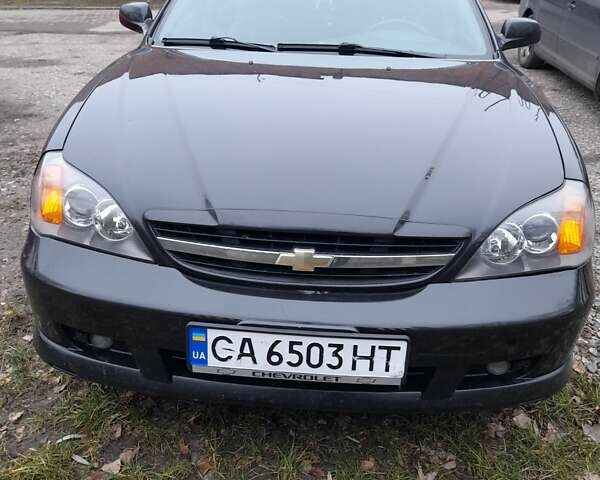 Черный Шевроле Эванда, объемом двигателя 2 л и пробегом 200 тыс. км за 3800 $, фото 1 на Automoto.ua