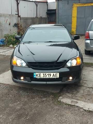 Черный Шевроле Эванда, объемом двигателя 2 л и пробегом 220 тыс. км за 4000 $, фото 1 на Automoto.ua