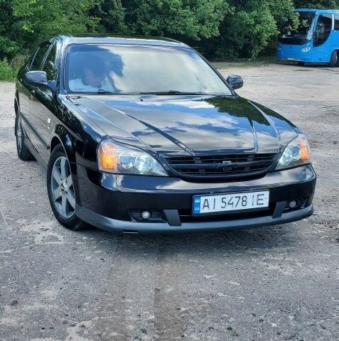 Черный Шевроле Эванда, объемом двигателя 2 л и пробегом 300 тыс. км за 3800 $, фото 1 на Automoto.ua