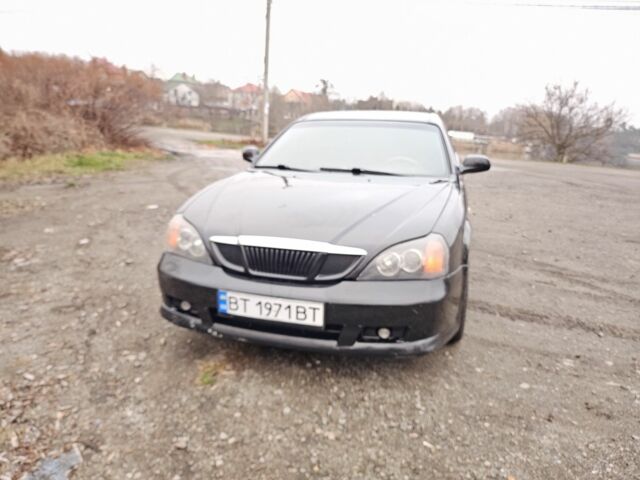 Черный Шевроле Эванда, объемом двигателя 2.5 л и пробегом 258 тыс. км за 4199 $, фото 1 на Automoto.ua