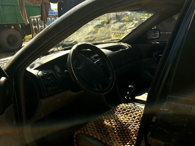 Чорний Шевроле Еванда, об'ємом двигуна 2 л та пробігом 350 тис. км за 3200 $, фото 1 на Automoto.ua