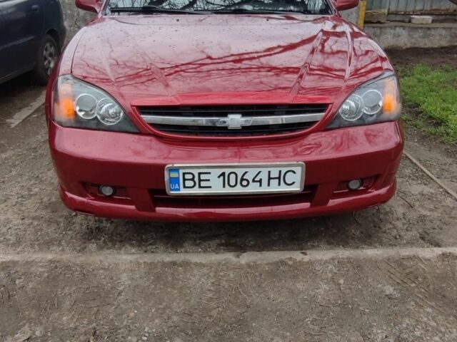 Красный Шевроле Эванда, объемом двигателя 2 л и пробегом 199 тыс. км за 4000 $, фото 1 на Automoto.ua