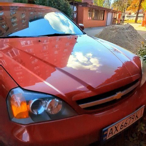 Красный Шевроле Эванда, объемом двигателя 2 л и пробегом 308 тыс. км за 2200 $, фото 1 на Automoto.ua