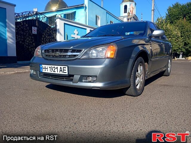 Серый Шевроле Эванда, объемом двигателя 2 л и пробегом 288 тыс. км за 3400 $, фото 1 на Automoto.ua