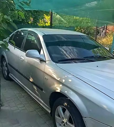 Сірий Шевроле Еванда, об'ємом двигуна 2 л та пробігом 200 тис. км за 2000 $, фото 1 на Automoto.ua