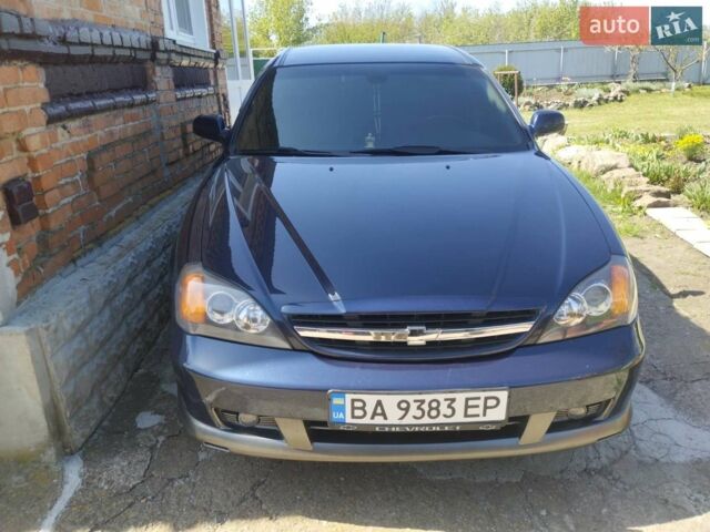 Синий Шевроле Эванда, объемом двигателя 2 л и пробегом 175 тыс. км за 5500 $, фото 1 на Automoto.ua