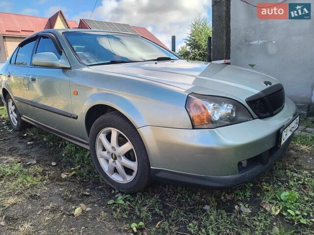 Зелений Шевроле Еванда, об'ємом двигуна 2 л та пробігом 265 тис. км за 3200 $, фото 1 на Automoto.ua