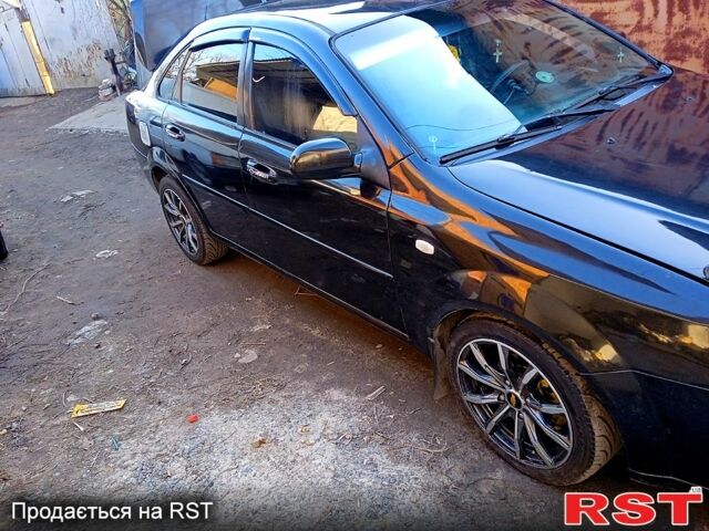 Черный Шевроле Лачетти, объемом двигателя 1.8 л и пробегом 244 тыс. км за 4700 $, фото 1 на Automoto.ua