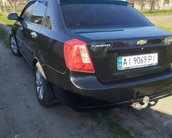 Черный Шевроле Лачетти, объемом двигателя 1.8 л и пробегом 275 тыс. км за 4800 $, фото 1 на Automoto.ua