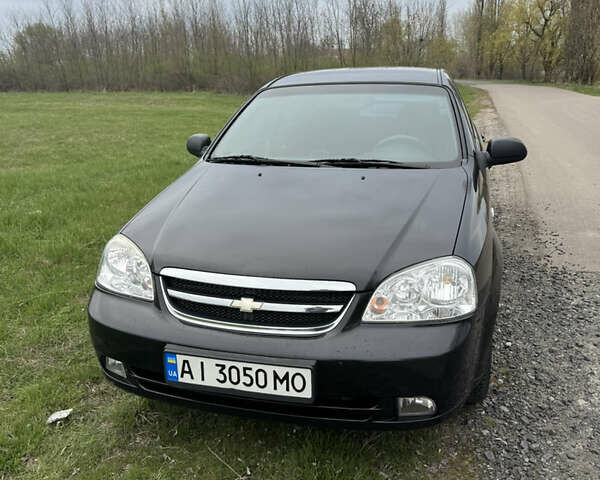Черный Шевроле Лачетти, объемом двигателя 1.6 л и пробегом 153 тыс. км за 5000 $, фото 1 на Automoto.ua