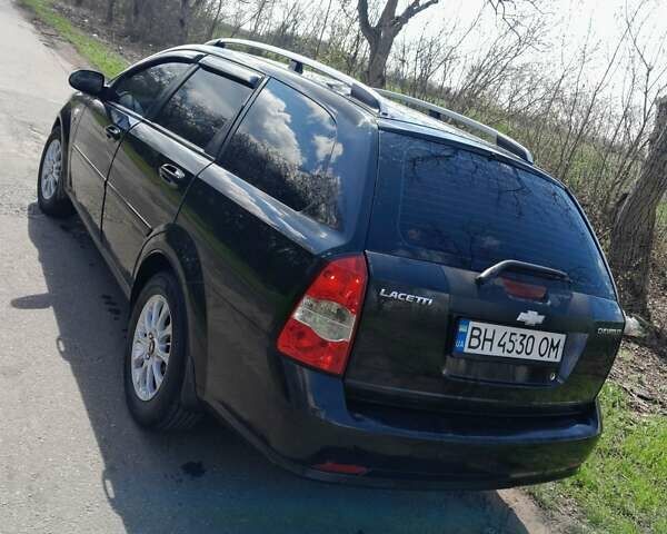 Черный Шевроле Лачетти, объемом двигателя 1.8 л и пробегом 260 тыс. км за 4900 $, фото 1 на Automoto.ua