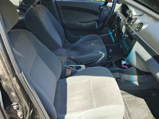 Черный Шевроле Лачетти, объемом двигателя 1.8 л и пробегом 300 тыс. км за 3000 $, фото 1 на Automoto.ua