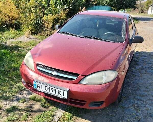 Красный Шевроле Лачетти, объемом двигателя 1.6 л и пробегом 303 тыс. км за 3300 $, фото 1 на Automoto.ua