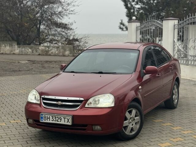 Червоний Шевроле Лачетті, об'ємом двигуна 1.8 л та пробігом 267 тис. км за 3900 $, фото 1 на Automoto.ua