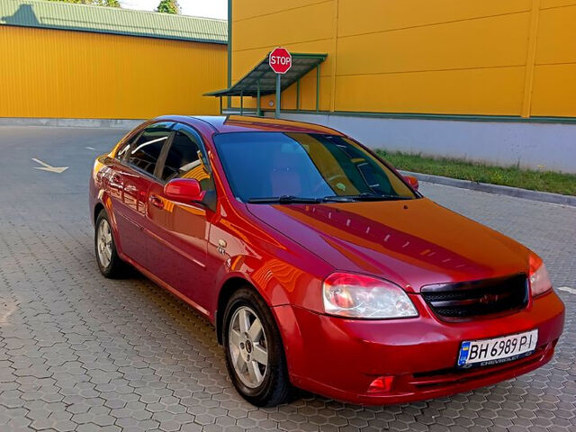 Красный Шевроле Лачетти, объемом двигателя 1.8 л и пробегом 180 тыс. км за 4550 $, фото 1 на Automoto.ua