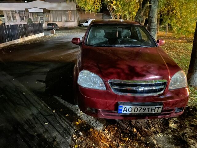 Красный Шевроле Лачетти, объемом двигателя 1.8 л и пробегом 240 тыс. км за 2000 $, фото 1 на Automoto.ua