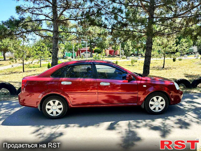 Красный Шевроле Лачетти, объемом двигателя 1.8 л и пробегом 185 тыс. км за 3900 $, фото 1 на Automoto.ua