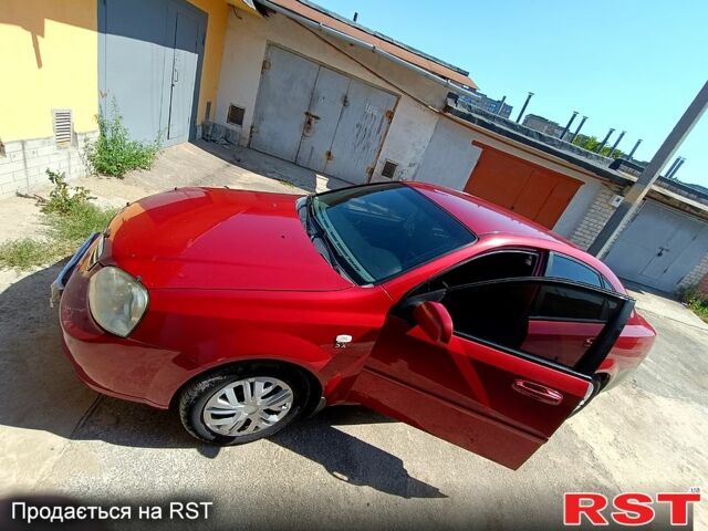 Красный Шевроле Лачетти, объемом двигателя 1.8 л и пробегом 186 тыс. км за 3000 $, фото 1 на Automoto.ua