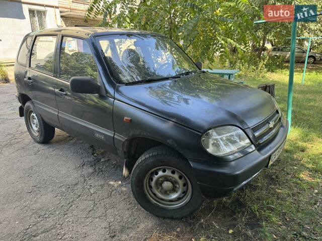 Черный Шевроле Нива, объемом двигателя 1.7 л и пробегом 228 тыс. км за 1900 $, фото 1 на Automoto.ua