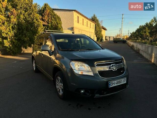 Серый Шевроле Орландо, объемом двигателя 1.8 л и пробегом 245 тыс. км за 9500 $, фото 1 на Automoto.ua