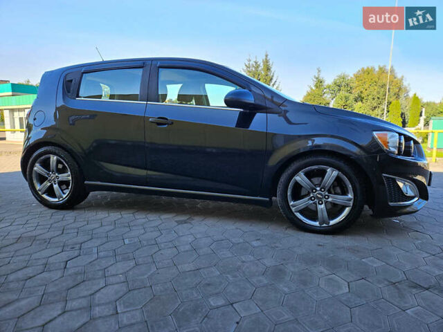 Черный Шевроле Соник, объемом двигателя 1.36 л и пробегом 144 тыс. км за 7500 $, фото 1 на Automoto.ua
