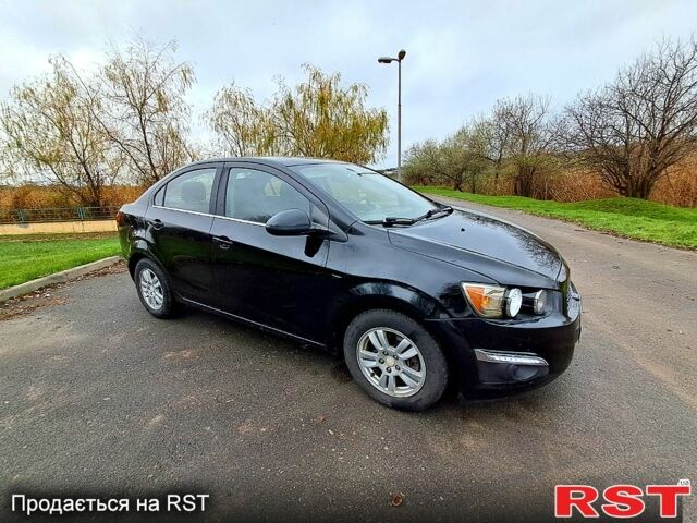 Черный Шевроле Соник, объемом двигателя 1.8 л и пробегом 103 тыс. км за 5500 $, фото 1 на Automoto.ua