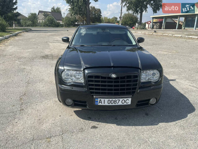 Черный Крайслер 300C, объемом двигателя 3.52 л и пробегом 260 тыс. км за 7200 $, фото 1 на Automoto.ua