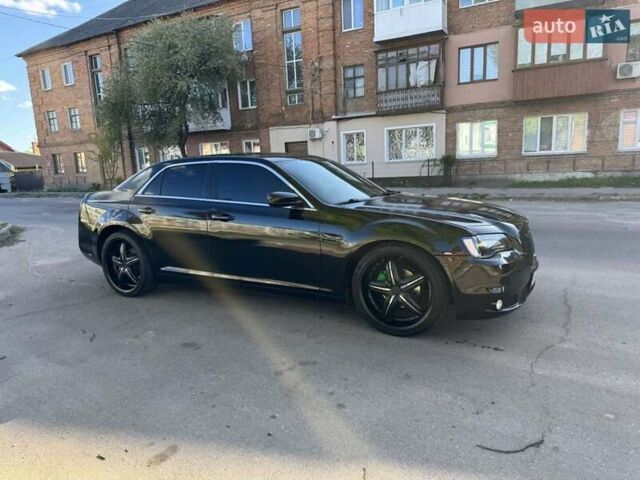 Чорний Крайслер 300, об'ємом двигуна 3.6 л та пробігом 276 тис. км за 9999 $, фото 1 на Automoto.ua