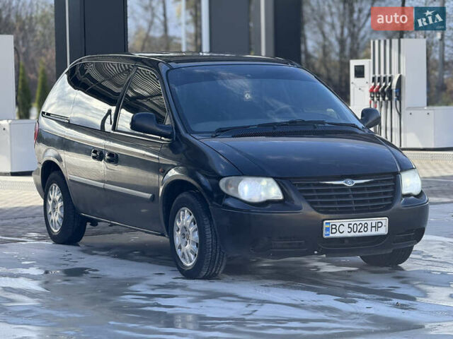 Черный Крайслер Гранд Вояджер, объемом двигателя 2.5 л и пробегом 320 тыс. км за 2999 $, фото 1 на Automoto.ua
